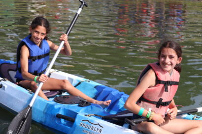 two kids on a kayak