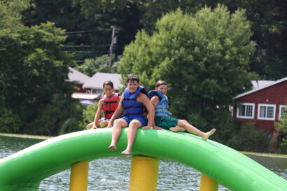 kids on floating water slide