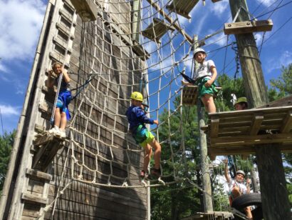 3 kids on a climbing gym