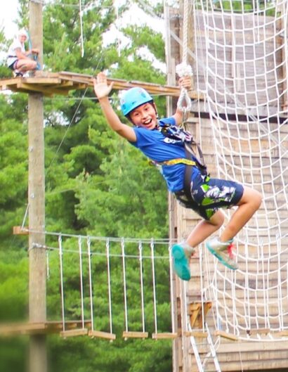 Kid on outdoor obstacle course